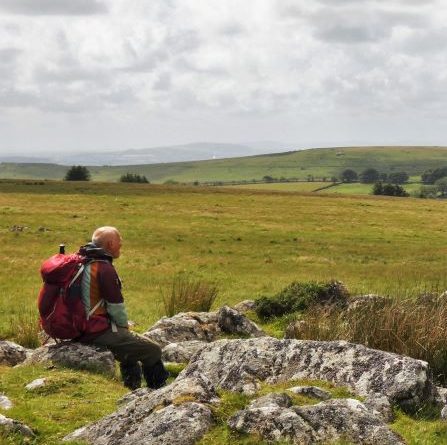 Man sitting on granite outcrop