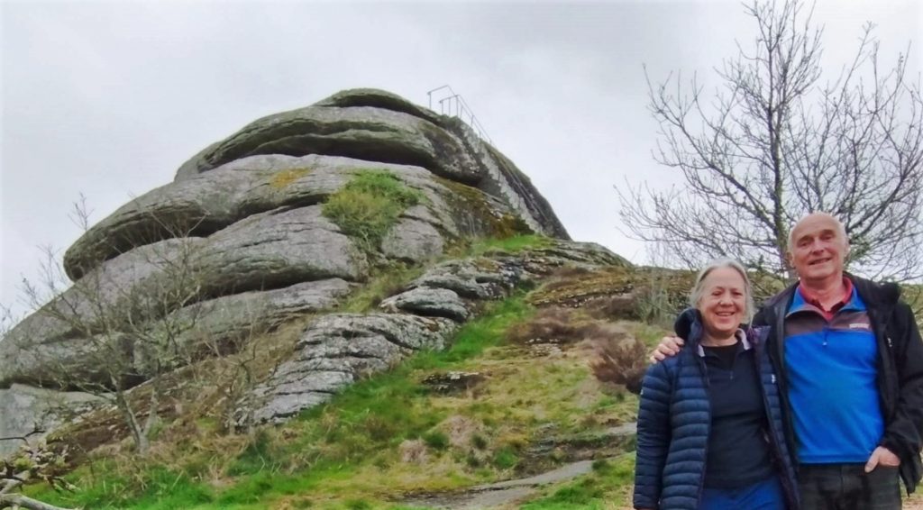 Michelle & Kevin in front of Blackingstone Rock. Steep staircase visible in background