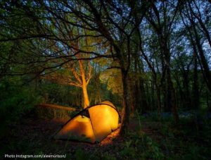 Vango lightweight tent on illuminated from within at night on Charcoal pitch