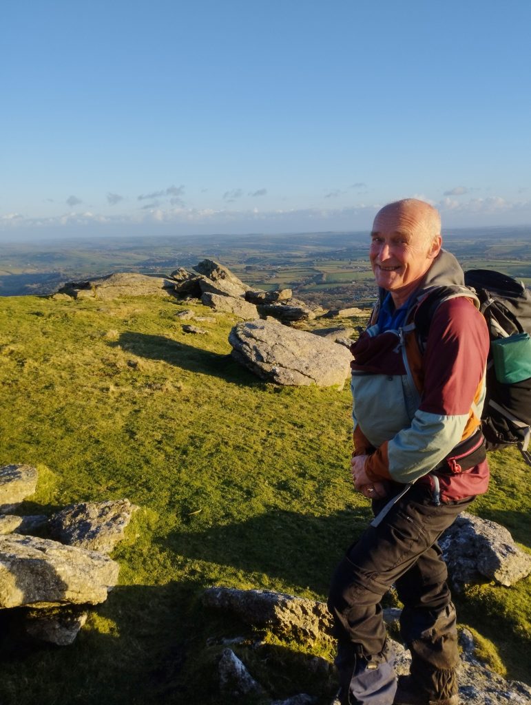 Kevin posing on the top of a tor on Dartmoor