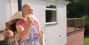 Michelle tossing pizza dough