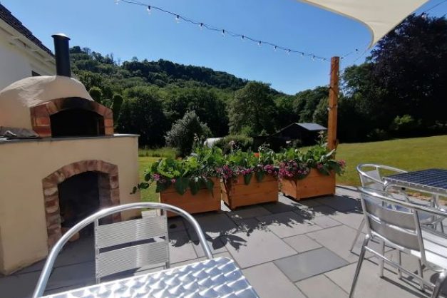 Relax on the patio by the pizza oven. Conveniently located just outside the bedrooms in the B&B accommodation